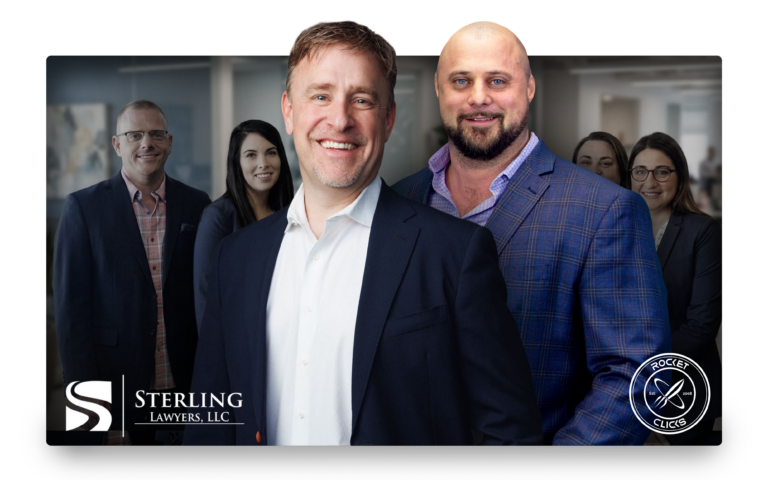 Smiling group of professionals in a corporate office, foreground two men in suits, with company logos visible at the bottom corners.